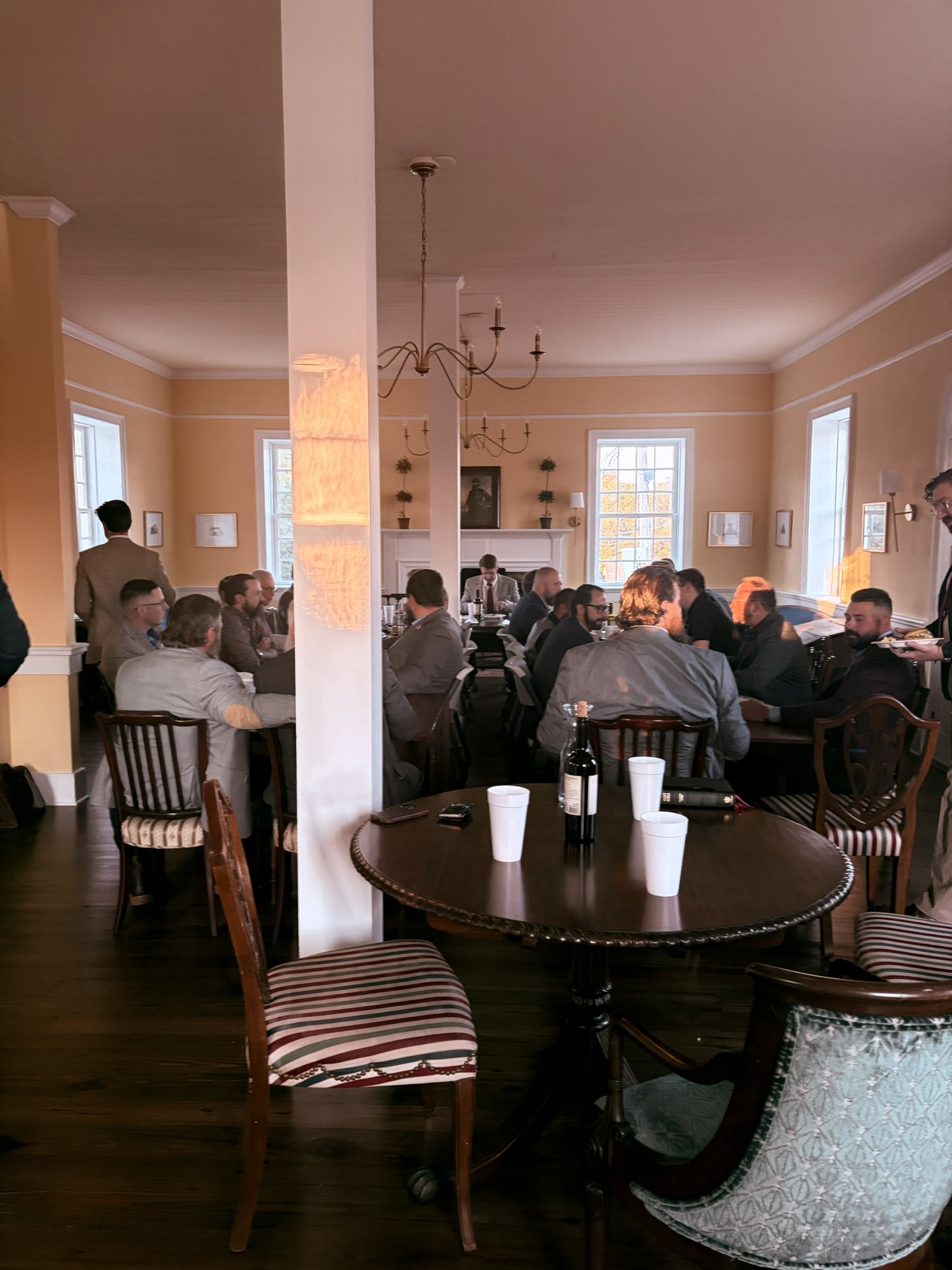 Men gathered for conversation and dinner at Stonewall Fellowship